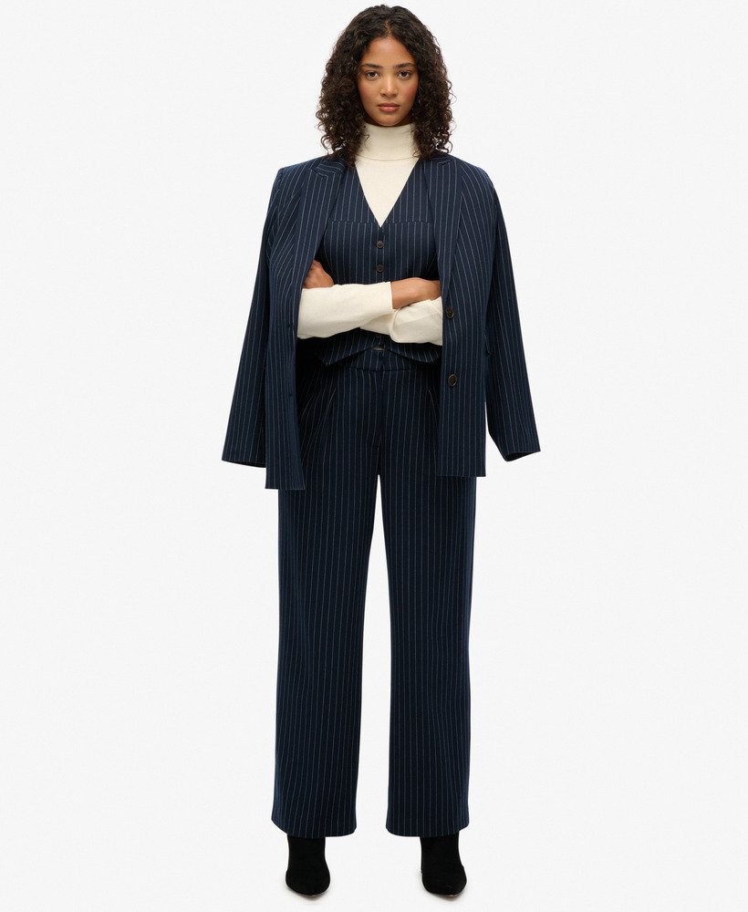 curved pinstripe trousers